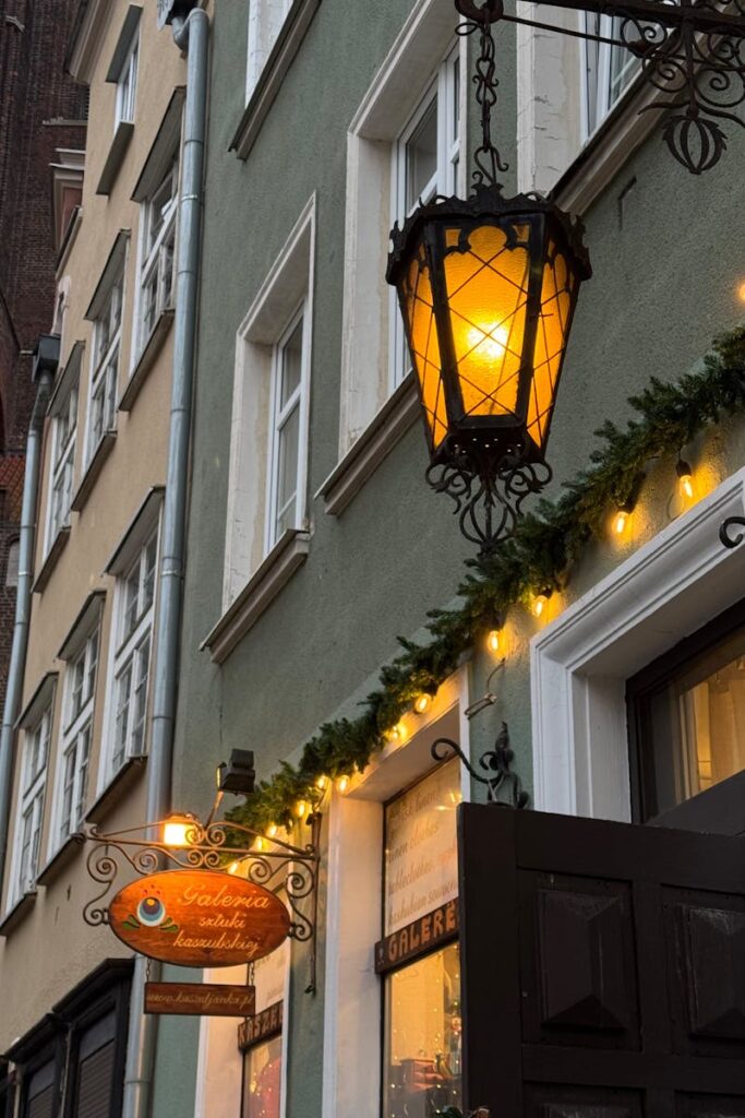 Cozy European street scene with vintage lanterns and festive lights, capturing holiday ambience.